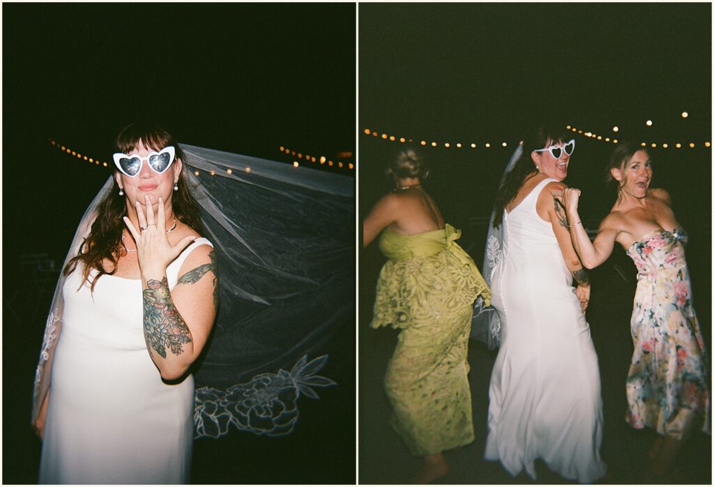 A bride dances with wedding guests in colorful dresses.