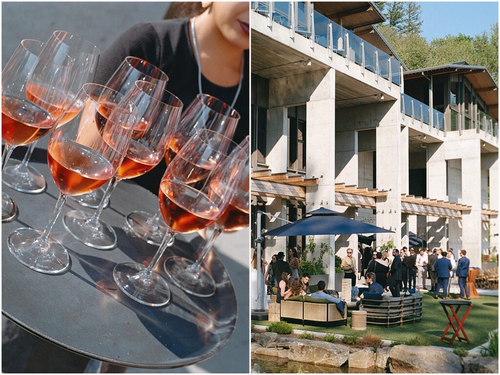 A server carries a tray of wine glasses to wedding guests.