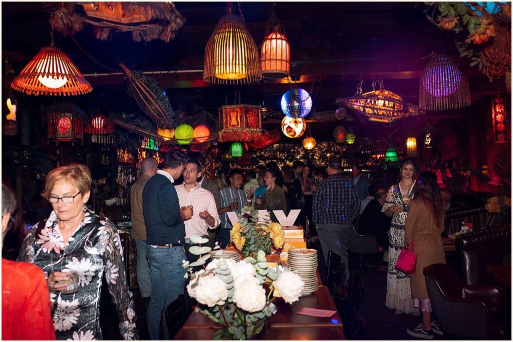 Wedding guests gather in a bar to celebrate a Portland elopement.